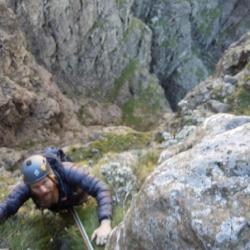 Climber approaching top of 3rd pitch.