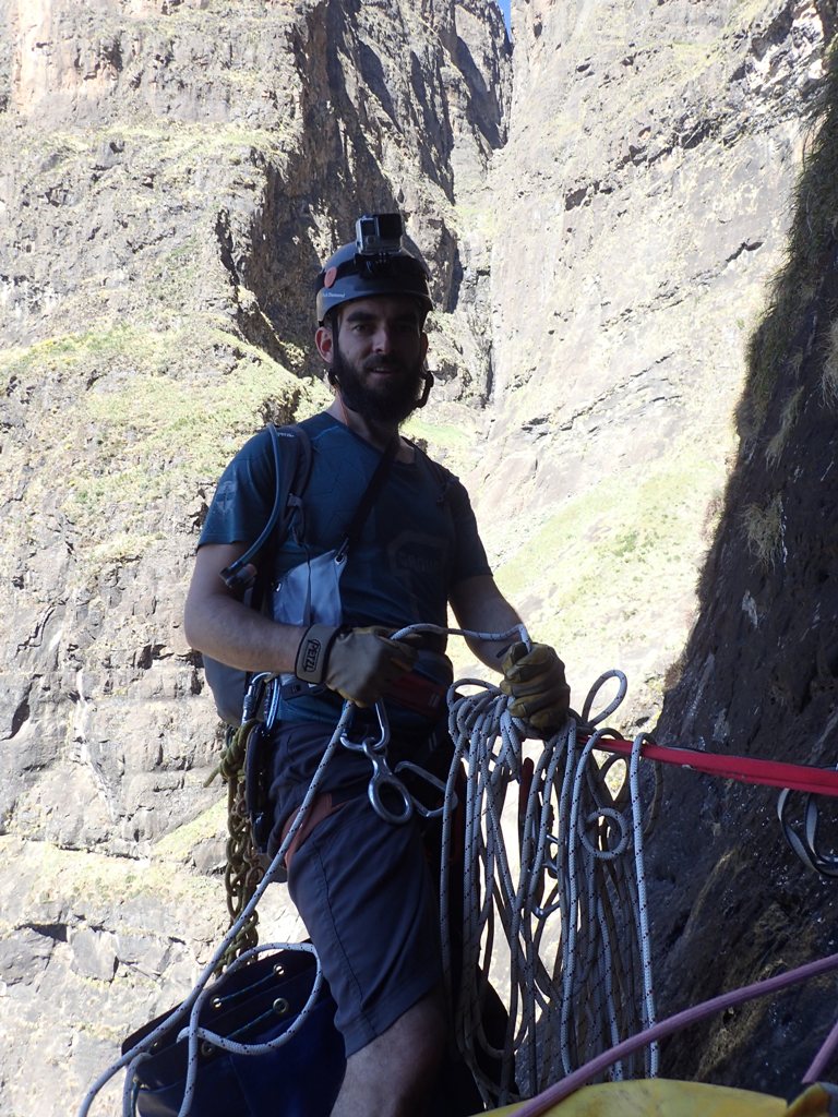 Samuel Chowles on the hanging stance after abseil 8