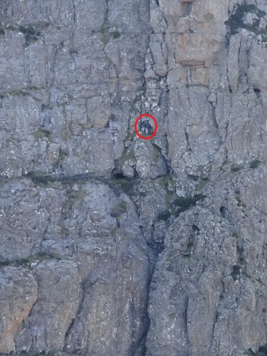 Climbers at base of the first abseil.